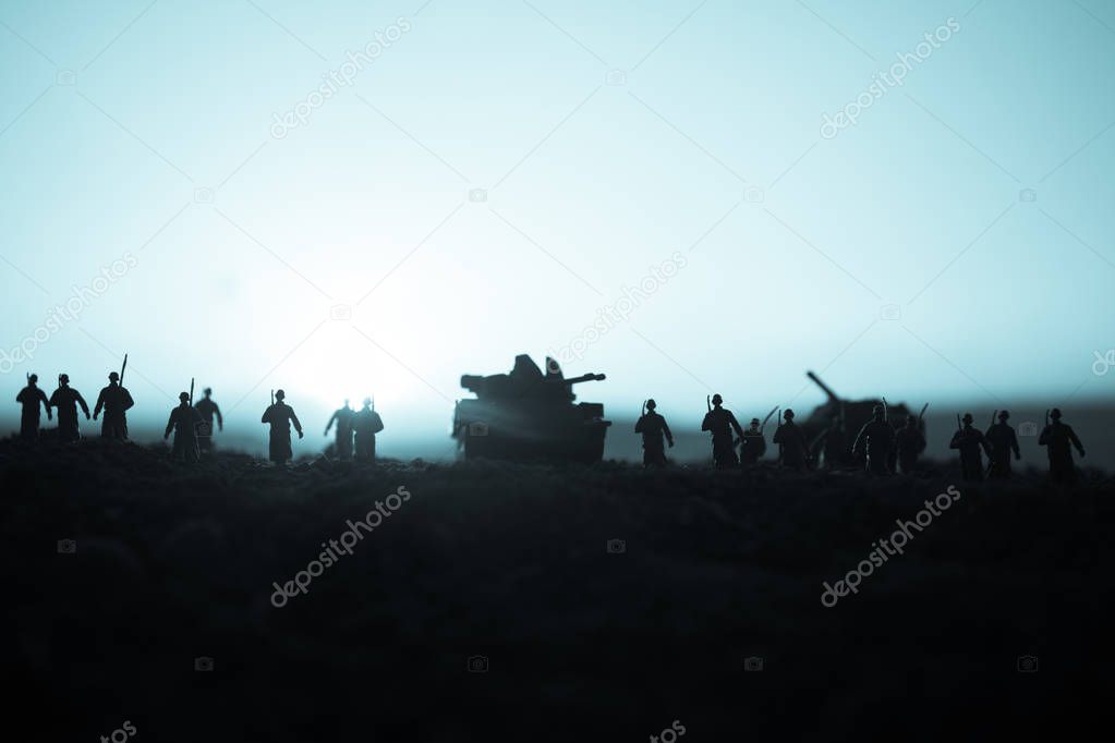 War Concept. Military silhouettes fighting scene on war fog sky background, World War Soldiers Silhouettes Below Cloudy Skyline at sunset. Attack scene. Armored vehicles. tank in action