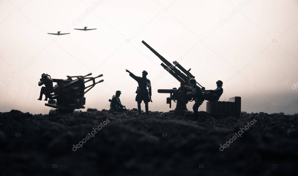 An anti-aircraft cannon and Military silhouettes fighting scene on war fog sky background. Allied air forces attacking on German positions. Artwork decorated scene. Selective focus