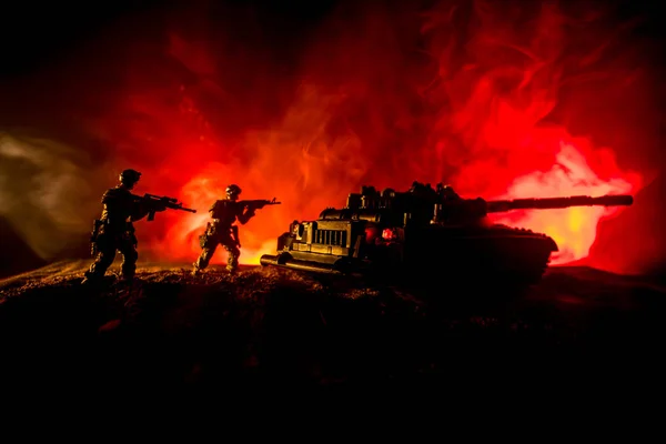 War Concept. Military silhouettes fighting scene on war fog sky background, Silhouette of armored vehicle below Cloudy Skyline At night. Attack scene. Tanks battle. Artwork decoration