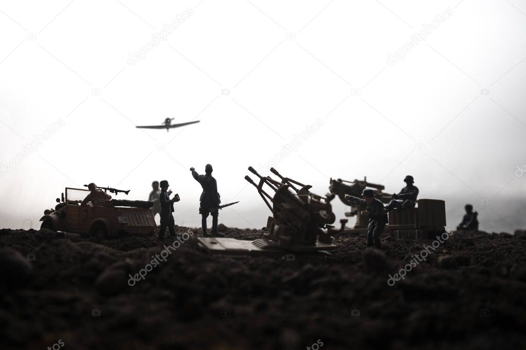 An anti-aircraft cannon and Military silhouettes fighting scene on war fog sky background. Allied air forces attacking on German positions. Artwork decorated scene. Selective focus