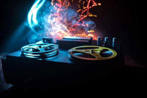 Old vintage reel to reel player and recorder on dark toned foggy