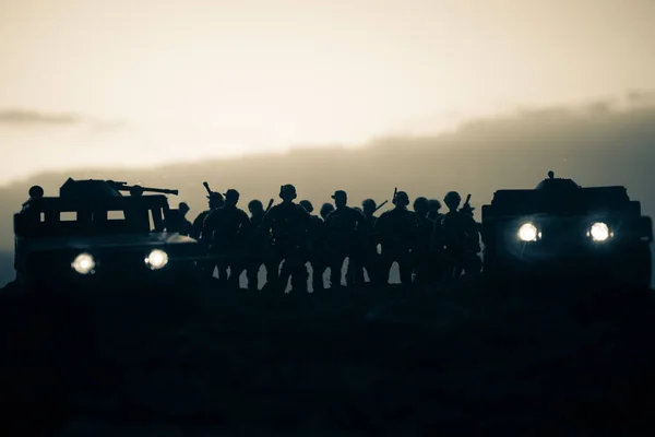 Military patrol car on sunset background. Army war concept. Silhouette of armored vehicle with gun in action. Decorated. Selective focus — Stock Photo, Image