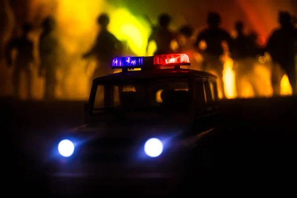 Police cars at night. Police car chasing a car at night with fog background. 911 Emergency response pSelective focus