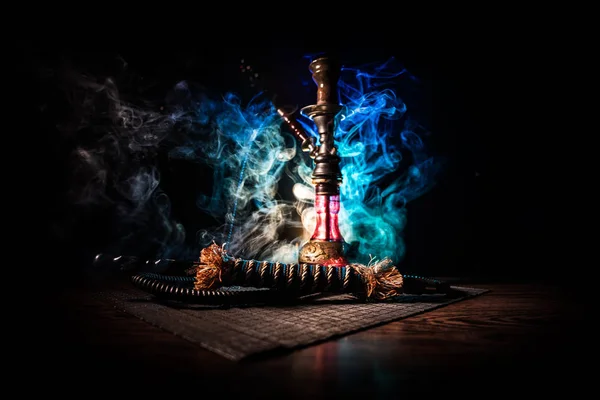 Hookah hot coals on shisha bowl on dark foggy background. Stylish oriental shisha. — Stock Photo, Image