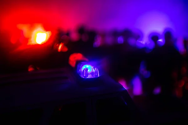 Anti-riot police give signal to be ready. Government power concept. Police in action. Smoke on a dark background with lights. Blue red flashing sirens. — Stock Photo, Image