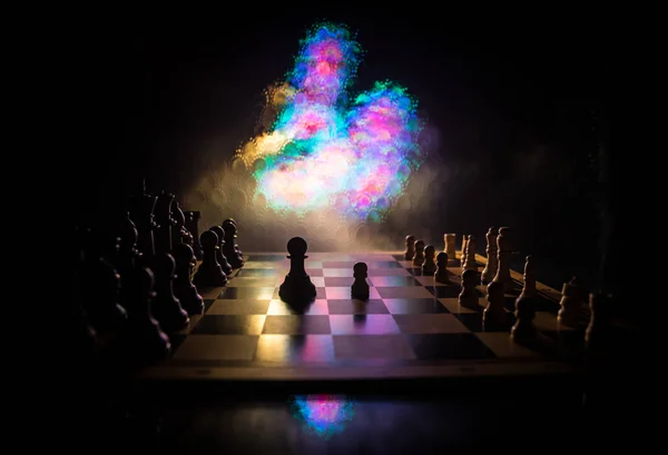 Chess board game concept of business ideas and competition. Chess figures on a dark background with smoke and fog. — Stock Photo, Image