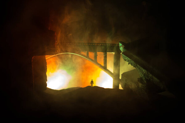 Apocalyptic ruins of the city. Disaster effect. Night scene. City destroyed by war. Destroyed skyscrapers