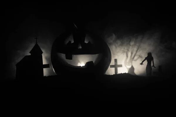 Scary view of zombies at cemetery dead tree, moon, church and spooky cloudy sky with fog, Horror Halloween concept with glowing pumpkin. — Stock Photo, Image