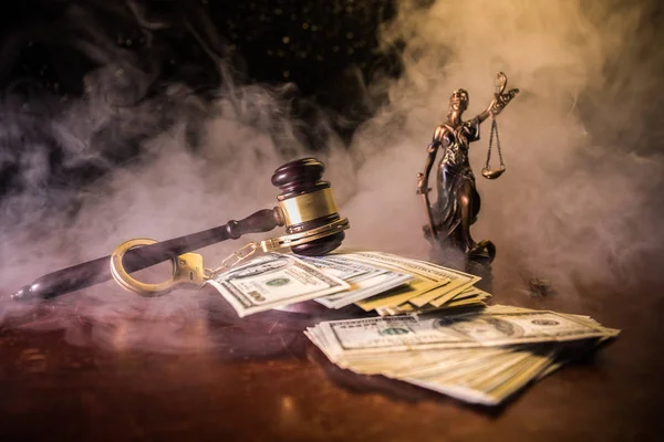 Law scales, dollars cash money, judge gavel, handcuff. Vintage old style sepia photo with fog — Stock Photo, Image