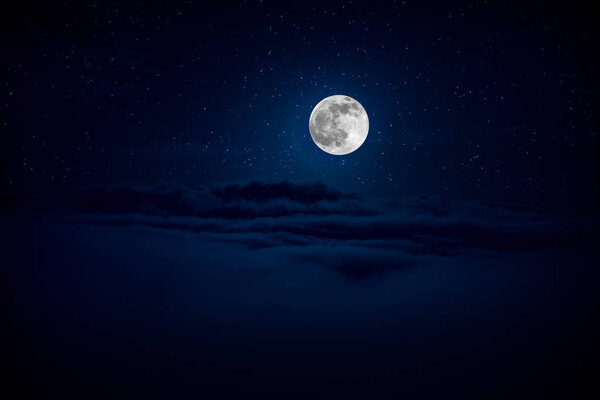 Backgrounds night sky with stars and moon and clouds. Beautiful full moon over clouds during night time
