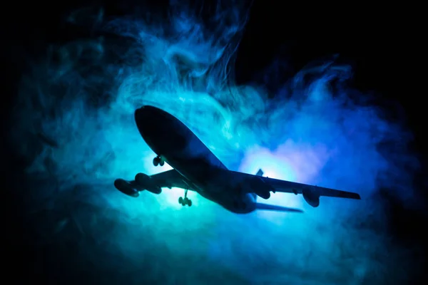 Artwork decoration. White passenger plane ready to taking off from airport runway. Silhouette of Aircraft during night time. — Stock Photo, Image