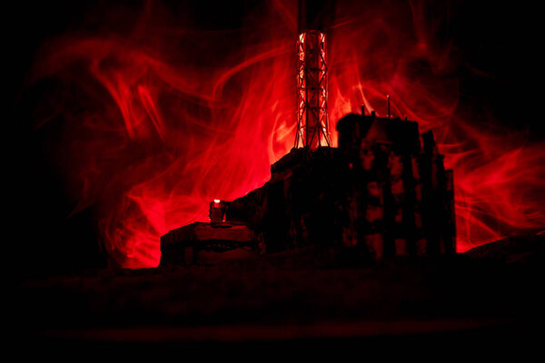 Creative artwork decoration. Chernobyl nuclear power plant at night. Layout of abandoned Chernobyl station after nuclear reactor explosion.