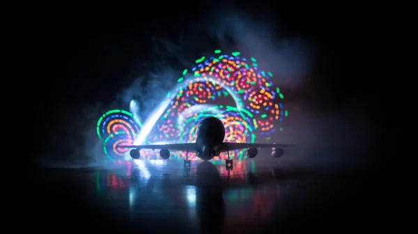 Artwork decoration. White passenger plane ready to taking off from airport runway. Silhouette of Aircraft during night time.