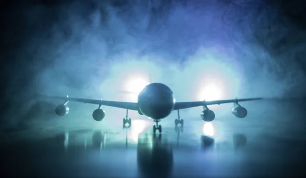 Artwork decoration. White passenger plane ready to taking off from airport runway. Silhouette of Aircraft during night time. — Stock Photo, Image