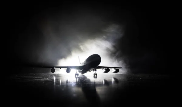 Artwork decoration. White passenger plane ready to taking off from airport runway. Silhouette of Aircraft during night time. — Stock Photo, Image