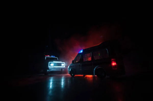 Corona virus concept with Ambulance car. Stay home for precautionary measures to prevent from corona virus. Ambulance car on dark misty background. Creative artwork decoration. Selective focus