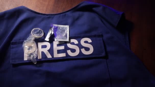 Close Footage Protective Press Vest Condom Wooden Table — Stock Video