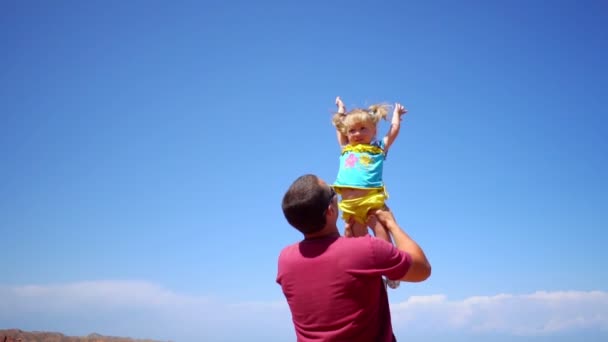 Father Raises Child His Arms — Stock Video