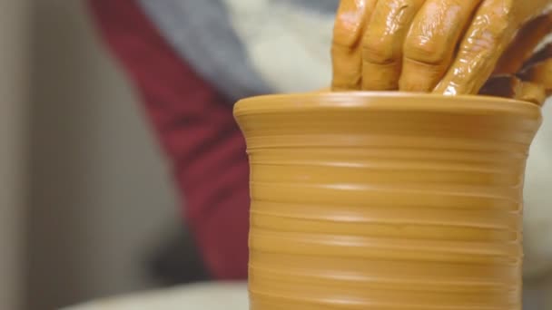 Potter makes a jug