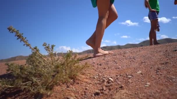 Girl walking barefoot on the ground — Stock Video
