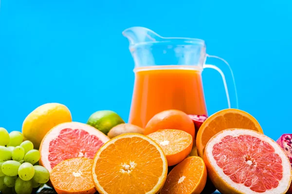 Freshly squeezed fruit juice. Healthy juicy vitamin drink, refreshing summer beverage with citrus fruits