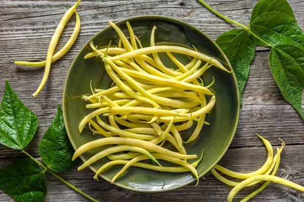 Yellow bean, organic vegetables from farmer market, farm fresh beans on plate, vegan food concept