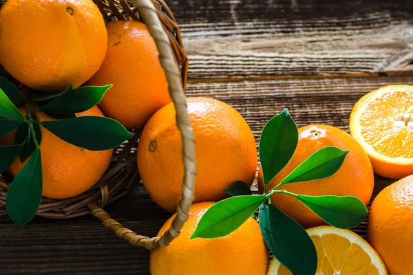 Fresh oranges on table. Organic orange fruit on wooden background