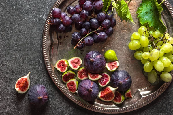 Bio organic fruits. Fresh figs and grapes. Assorted fruit on catering platter. Food for sharing.