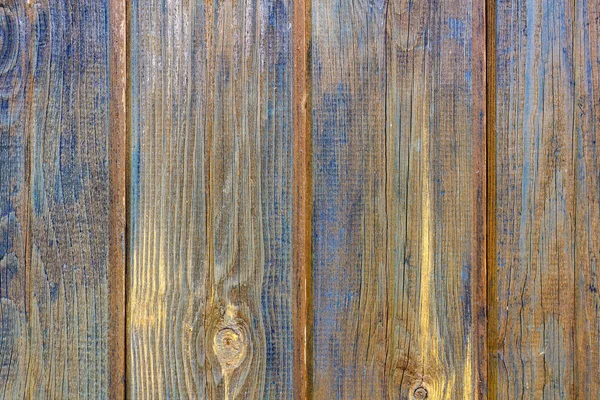 Texture of scuffed blue painted wooden planks with cracks. Abstract wooden background