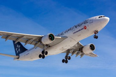 Moscow, Russia - March 14, 2019: Aircraft Airbus A330-200 TC-LNB of Turkish Airlines going to landing at Vnukovo airport in Moscow on a blue sky background at sunny day clipart