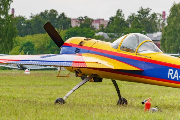 Balashikha, Moscow region, Russia - May 25, 2019: Russian sports and aerobatic aircraft SP-55F RA-2934G parked on a green grass of airfield Chyornoe at Aviation festival Sky Theory and Practice 2019 — Stock Photo, Image