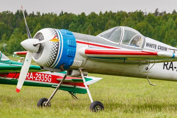 Balashikha, Moscow region, Russia - May 25, 2019: Russian sports and aerobatic aircraft SP-55M RA-2937G parked on a green grass of airfield Chyornoe at Aviation festival Sky Theory and Practice 2019 — Stock Photo, Image