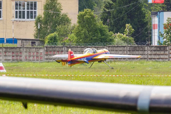 Balashikha, Moscow region, Russia - May 25, 2019: Russian sports and aerobatic aircraft SP-55F RA-2934G parked on a green grass of airfield Chyornoe at Aviation festival Sky Theory and Practice 2019 — Stock Photo, Image