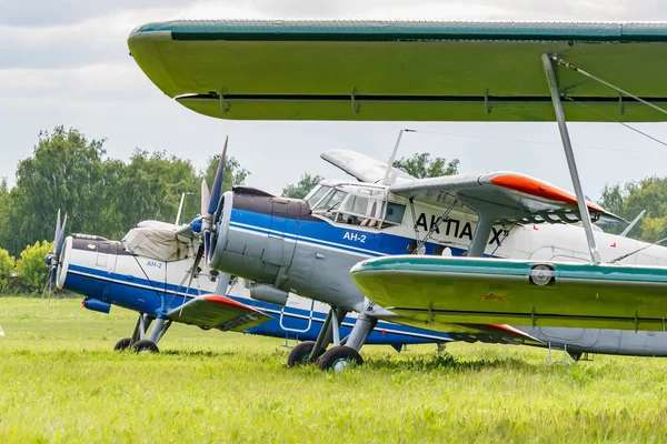 Balashikha, Moscow region, Russia - May 25, 2019: Soviet aircraft biplane Antonov AN-2 parked on a green grass of airfield against cloudy sky at Aviation festival Sky Theory and Practice 2019 — Stock Photo, Image