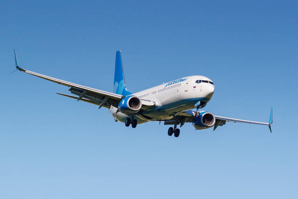 Moscow, Russia - May 19, 2019: Aircraft Boeing 737-8AL(WL) VP-BPL of Pobeda airline landing at Vnukovo international airport in Moscow on a blue sky background at sunny day