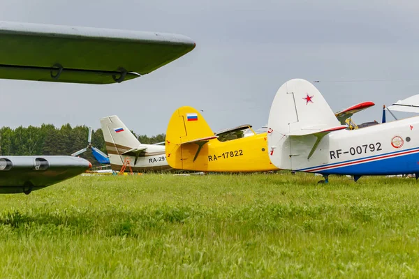 Balashikha, Moscow region, Russia - May 25, 2019: Soviet aircrafts biplane Antonov AN-2 parked on a green grass of airfield closeup at Aviation festival Sky Theory and Practice 2019 — Stock Photo, Image