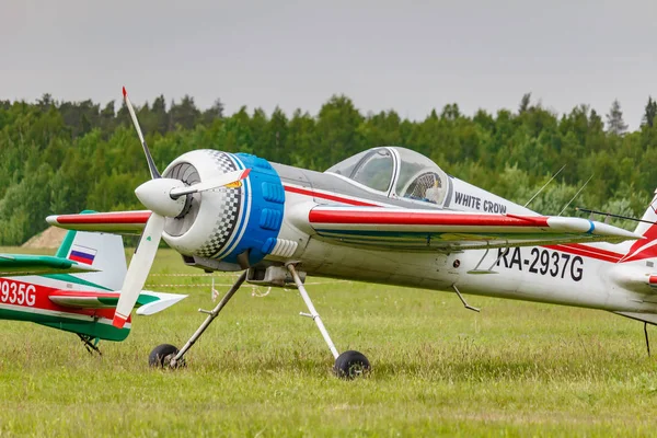 Balashikha, Moscow region, Russia - May 25, 2019: Russian sports and aerobatic aircraft SP-55M RA-2937G parked on a green grass of airfield Chyornoe at Aviation festival Sky Theory and Practice 2019 — Stock Photo, Image