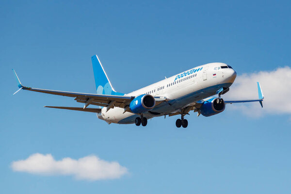 Moscow, Russia - April 03, 2019: Aircraft Boeing 737-8AL(WL) VP-BPS of Pobeda airline going to landing against blue sky at Vnukovo international airport in Moscow at sunny day