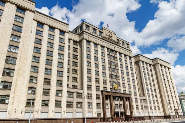 Moscow, Russia - June 02, 2019: Building of State Duma of Russian Federation on Okhotny Ryad street in Moscow on a background of blue sky with white clouds in sunny morning — Stock Photo, Image