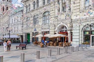 Moscow, Russia - July 28, 2019: Outdoor cafe verandas on Nikolskaya street in Moscow at sunny summer morning clipart