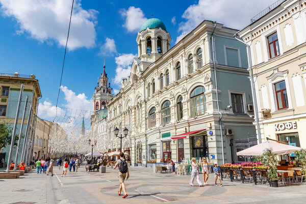 Moscow, Russia - July 28, 2019: Tourists on Nikolskaya street in Moscow. Popular touristic landmark of the Moscow historical center at sunny summer morning