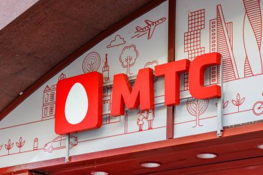 Moscow, Russia - September 13, 2019: MTS sign on the storefront close-up. Signboard of Mobile TeleSystems russian telecommunications company clipart