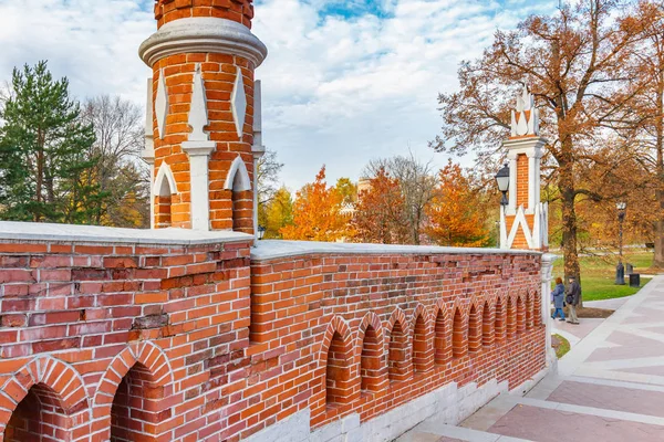 stock image Moscow, Russia - October 16, 2019: Architecture of Tsaritsyno Park in Moscow. Figured Bridge against trees with colored leaves at sunny autumn day