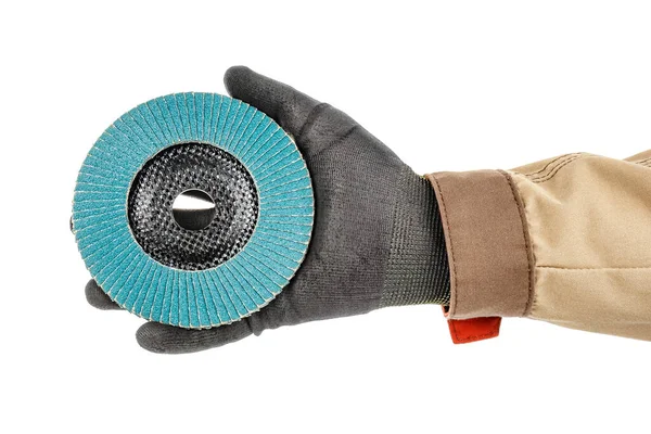 Blue abrasive flap disc for grinding on palm of worker hand in black protective glove and brown uniform isolated on white background — Stock Image Blue Abrasive Flap Disc Grinding Palm Worker Hand Black Protective Stock Photo