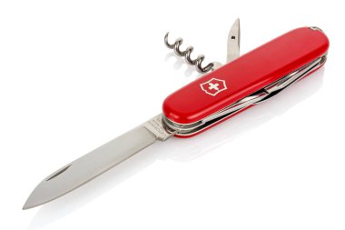 Moscow, Russia - May 15, 2020: Red Victorinox classic swiss pocket foldable knife with open blade, corkscrew and piercer isolated on white background with reflection on glossy surface clipart