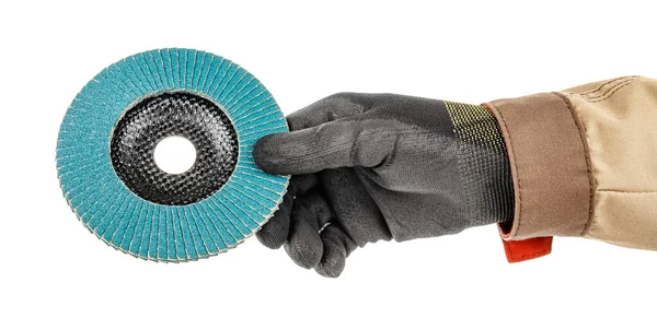 Man hand in black protective glove and brown uniform holding by fingers blue abrasive flap disc for grinding isolated on white background — Stock Image Man Hand Black Protective Glove Brown Uniform Holding Fingers Blue Royalty Free Stock Images