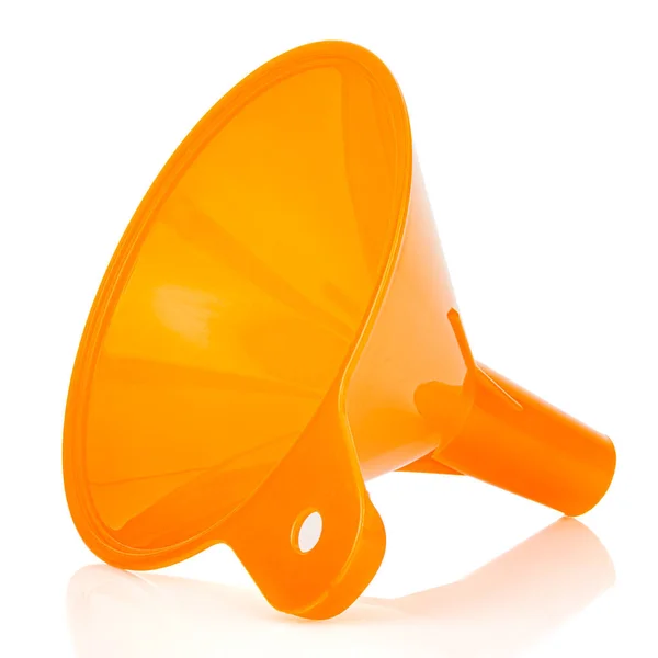 Lying orange plastic funnel isolated on white background