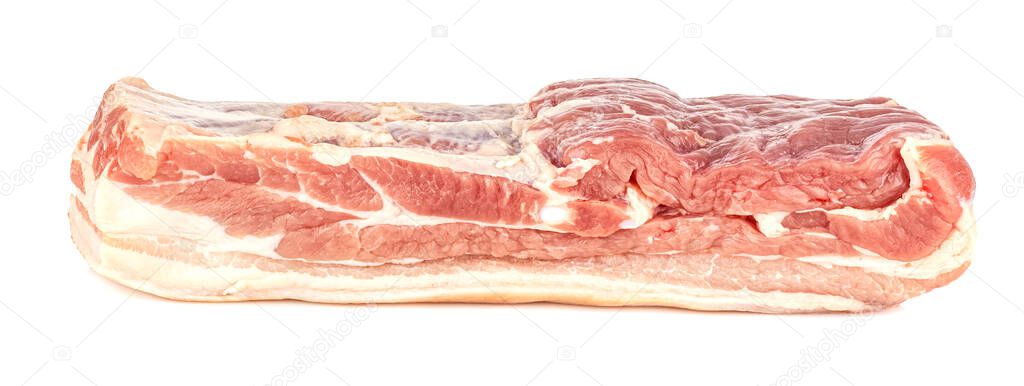Side view of uncooked pork belly with a thin layer of fat isolated on white background