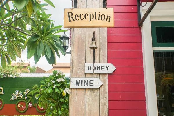 Hanging Wooden Signpost Reception Hotel Wine Honey — Stock Photo, Image