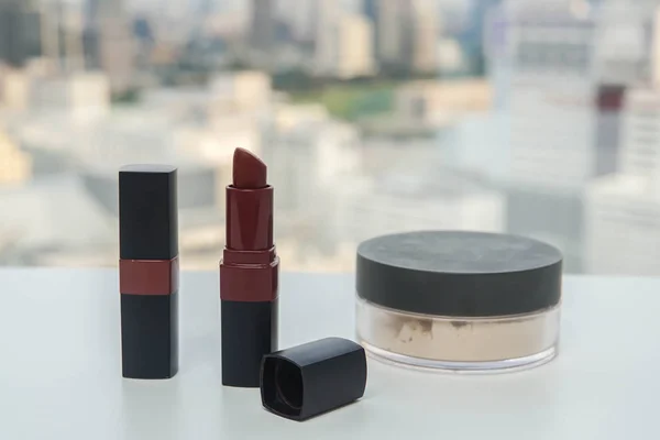 red matte lipstick and facial powder for women make up